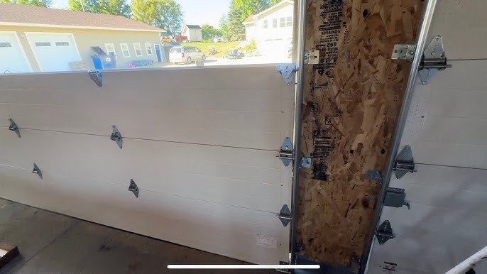 Garage door section replacement service of Garage Door Repair Lewis Center.
