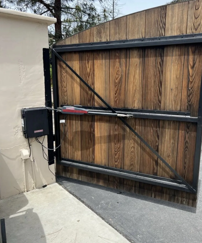 "Technician repairing a residential gate in Lewis Center, Florida to ensure durability and security."