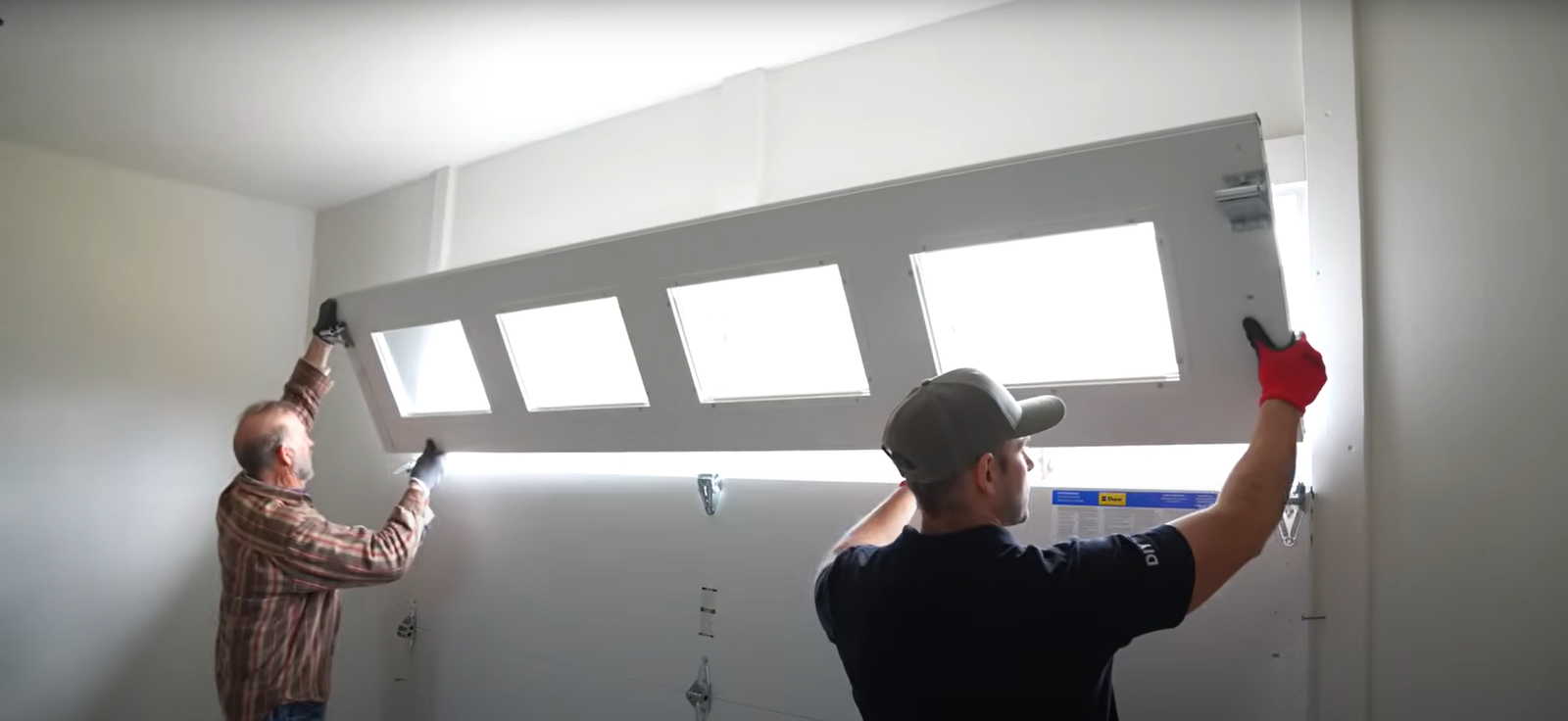 "Garage door repair services in Lewis Center, Ohio, featuring professional technicians fixing a residential garage door."