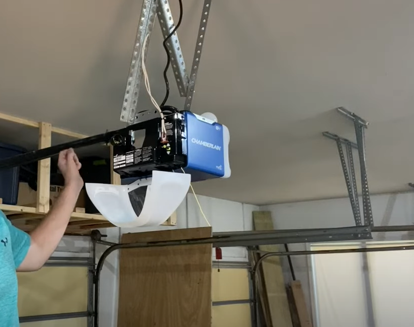 a professional technician repairing a garage door opener, highlighting the expertise of Garage Door Repair Lewis Center in providing top-quality garage door opener repair services.